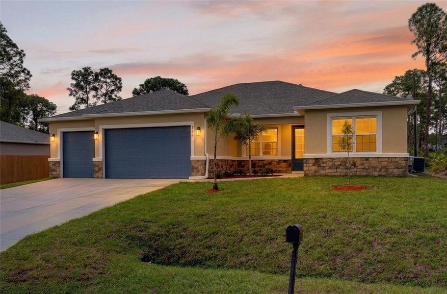 Front exterior of a new home in , Palm Bay, FL, highlighting curb appeal (Image 21).