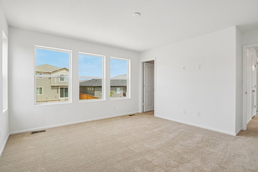 Spacious, unfurnished interior of a new home in The Cottages Collection at Ridgeline Vista, Brighton (Image 17).