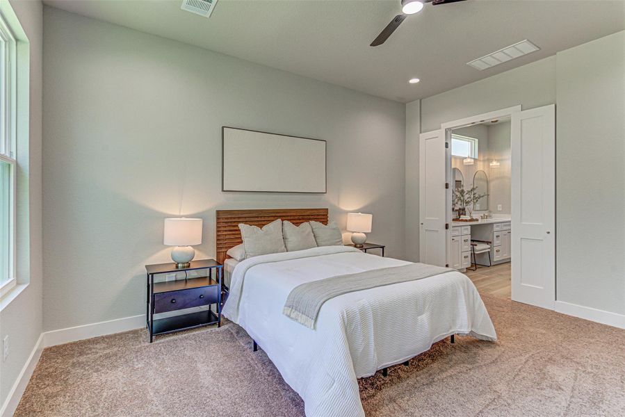 Main Bedroom with high ceilings and a ceiling fan.