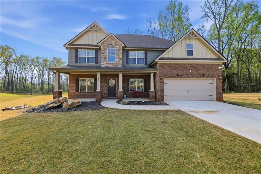 Front exterior of a new home in Nine Oaks, Locust Grove, GA, highlighting curb appeal (Image 26).
