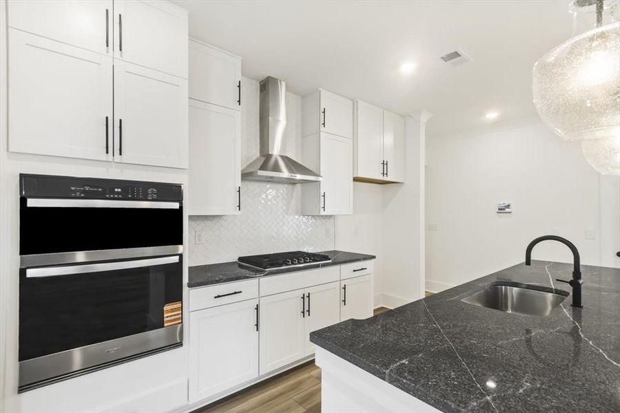 Gleaming quartz countertops and sleek modern cabin