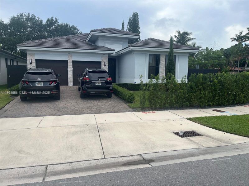 Front exterior of a new home in , Miami, FL, highlighting curb appeal (Image 12).
