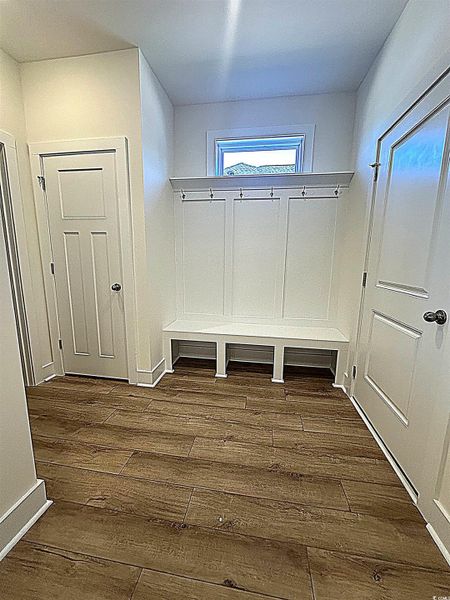 Mudroom with dark wood-type flooring