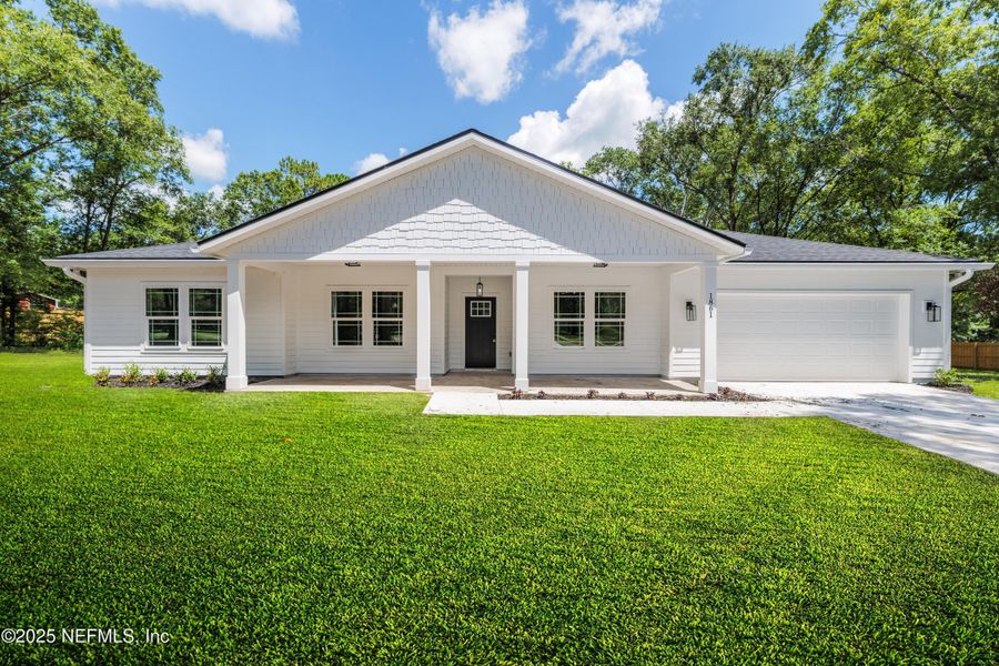 Front exterior of a new home in , Middleburg, FL, highlighting curb appeal (Image 1). Front exterior of a new home in , Middleburg, FL, highlighting curb appeal (Image 1).