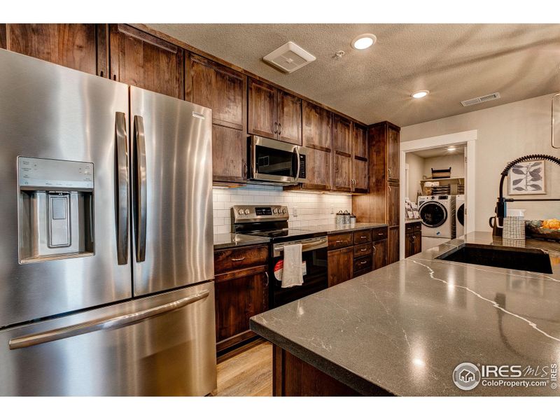 Kitchen-  Photos not of the actual unit. Finishes vary.