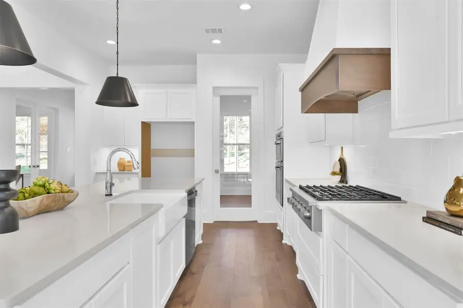 Glass door leads to a large custom pantry. Glass door leads to a large custom pantry.