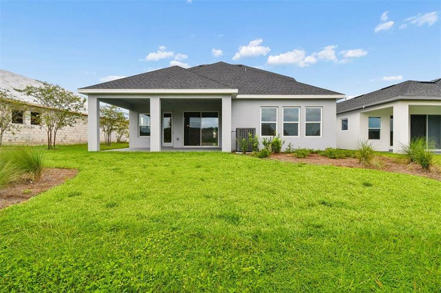 Exterior details and patio area of a home in Oakfield at Mount Dora Village Series, Mount Dora (Image 17).