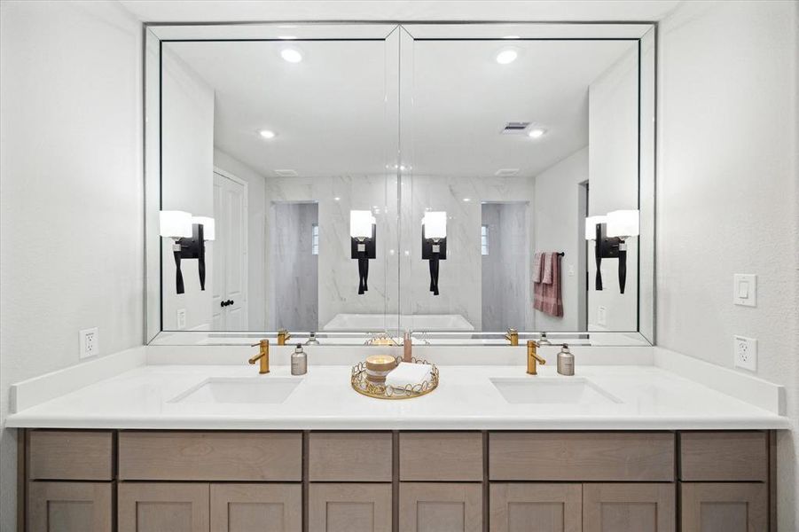 Beveled mirror with Kilcher Marette Scones and double sinks.