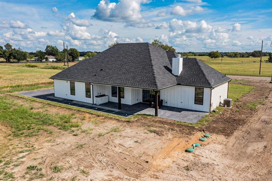 View of front of home featuring central AC unit and a patio