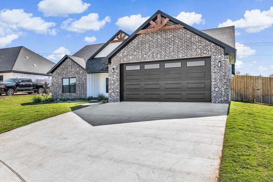 Front exterior of a new home in , Hewitt, TX, highlighting curb appeal (Image 15).