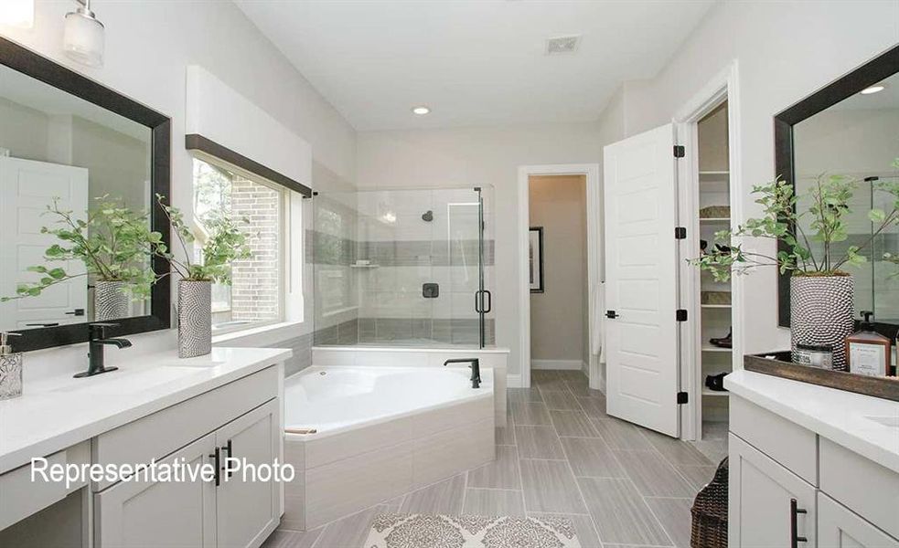 Bathroom with tile floors, independent shower and bath, and vanity