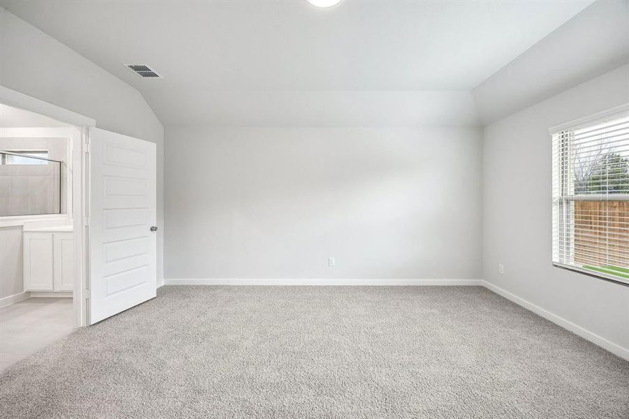 Primary Suite in the Heisman home plan by Trophy Signature Homes – REPRESENTATIVE PHOTO