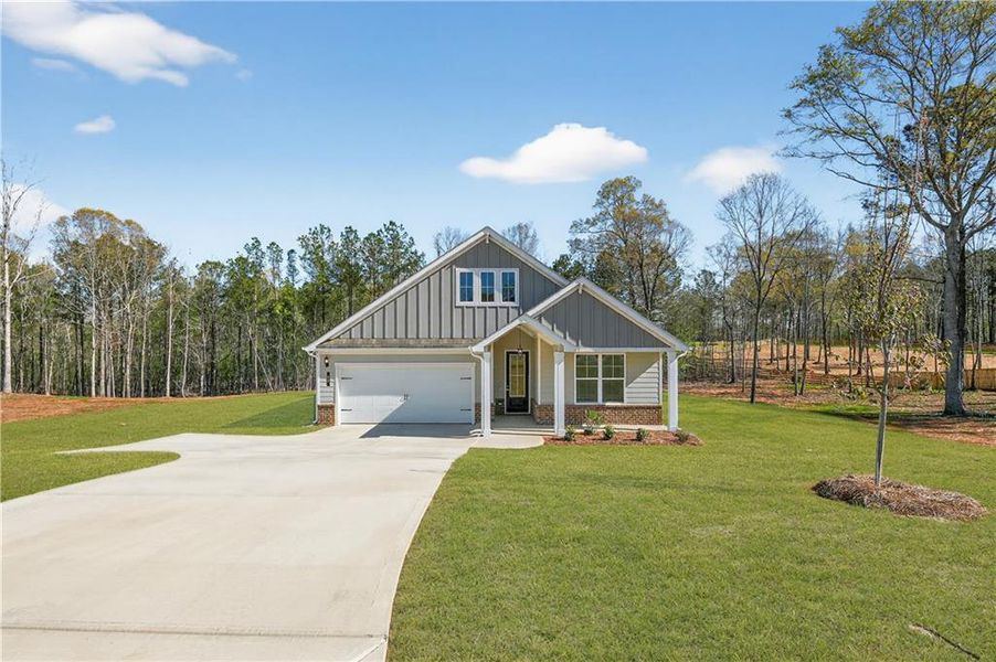 Front exterior of a new home in Waters Edge, Mansfield, GA, highlighting curb appeal (Image 15).