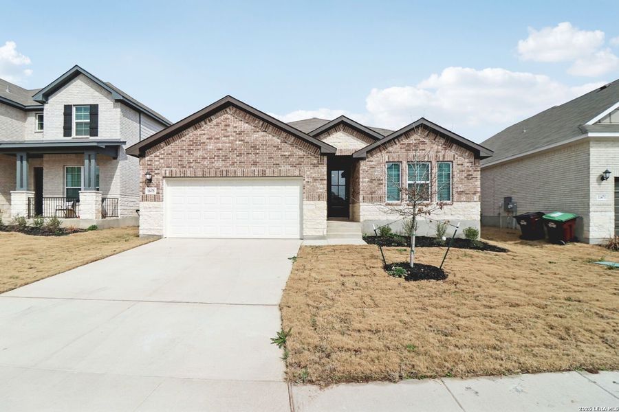Front exterior of a new home in Sagebrooke - Classic Series, San Antonio, TX, highlighting curb appeal (Image 25).