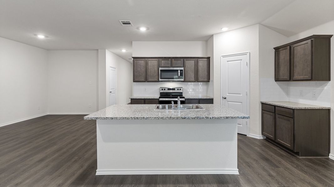 Representative furnished interior of a home built from the X40L Lakeway by D.R. Horton in Valor Farms, Royse City (Image 10).