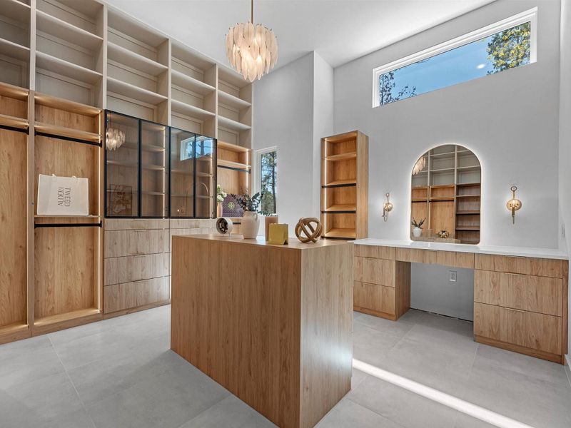 The primary closet also provides a vanity for getting ready along with lots of natural light.