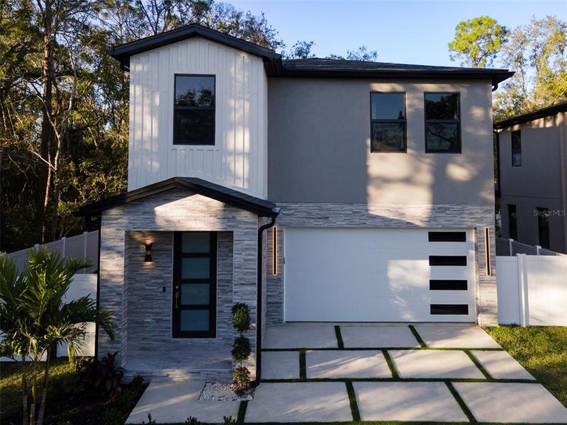 Front exterior of a new home in , Tampa, FL, highlighting curb appeal (Image 25).