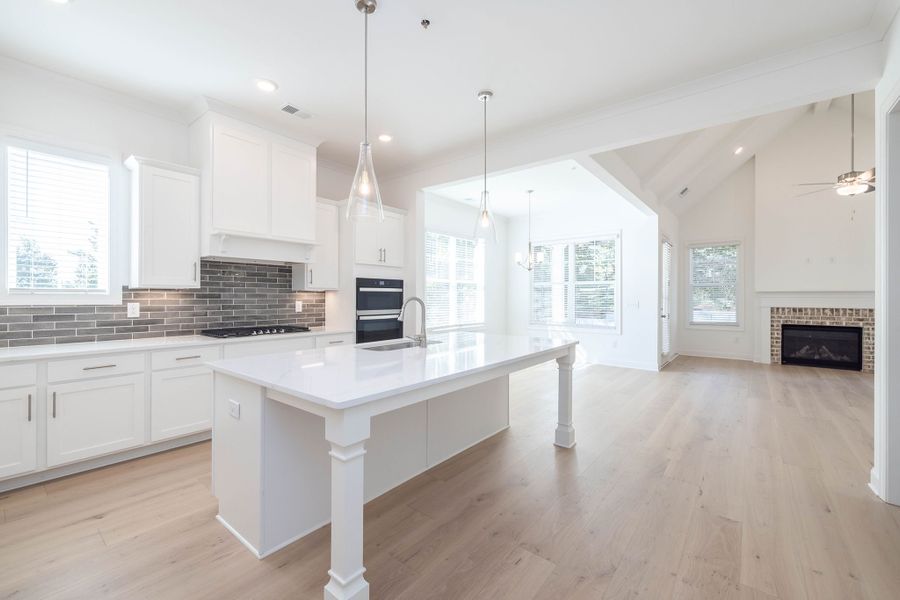 The spacious kitchen and dining area open to the family room for easy entertaining