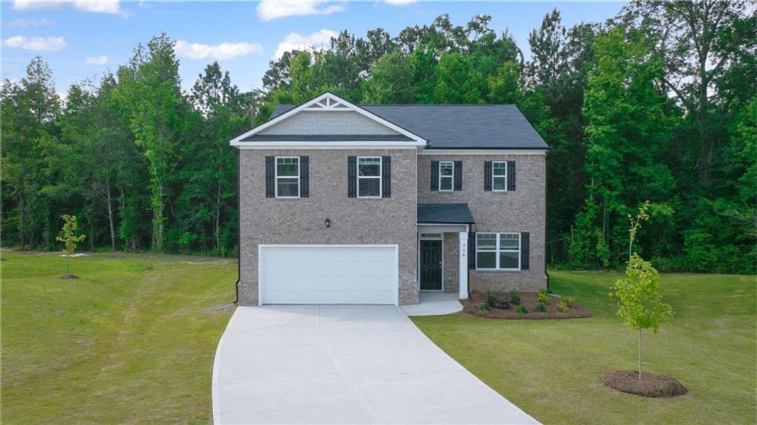 Front exterior of a new home in The Reserve at Calcutta, Stockbridge, GA, highlighting curb appeal (Image 2).