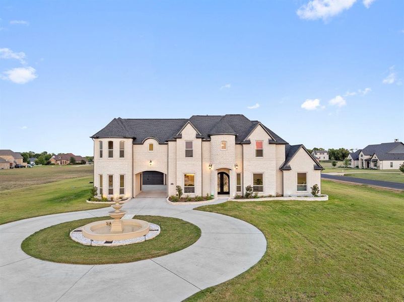 French country style house with a front lawn