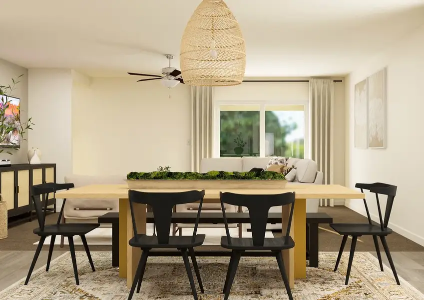 Rendering of a dining room furnished with a large six-person table. The living room can be seen from behind the table. Rendering of a dining room furnished with a large six-person table. The living room can be seen from behind the table.