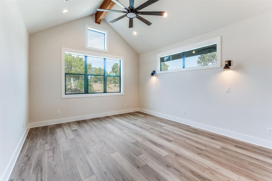 Unfurnished room with a ceiling fan, light wood finished floors, and recessed lighting