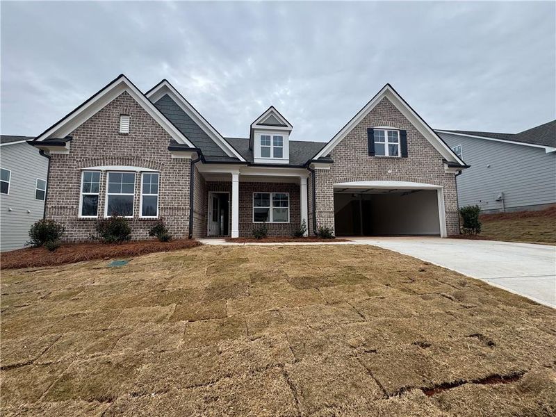 Front exterior of a new home in Rosewood Lake Preserve, Hoschton, GA, highlighting curb appeal (Image 1).