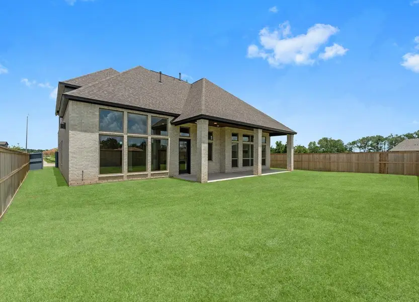 Front exterior of a new home in Fulshear Lakes 70’s, Fulshear, TX, highlighting curb appeal (Image 1). Front exterior of a new home in Fulshear Lakes 70’s, Fulshear, TX, highlighting curb appeal (Image 1).