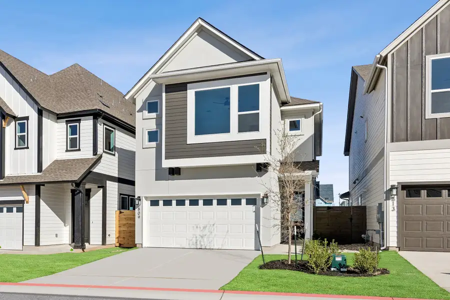 Front exterior of a new home in Double Creek Crossing, Round Rock, TX, highlighting curb appeal (Image 2). Front exterior of a new home in Double Creek Crossing, Round Rock, TX, highlighting curb appeal (Image 2).