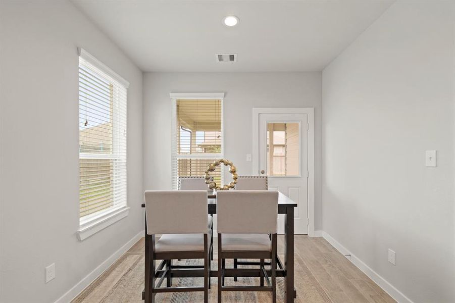The breakfast area, conveniently located next to the kitchen and living room, offers plenty of space for a large table—perfect for family meals and gatherings!
