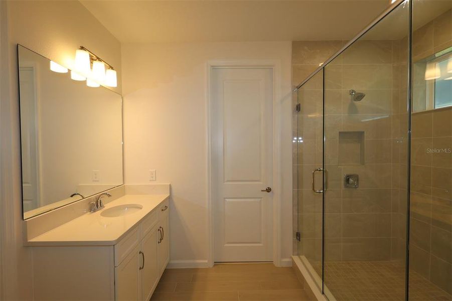 Furnished interior view inside a new home in Center Lake on the Park, St. Cloud (Image 9).