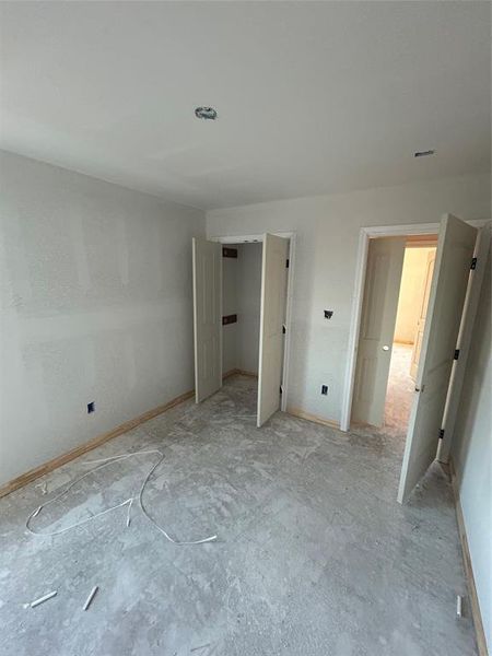 Unfurnished bedroom featuring baseboards