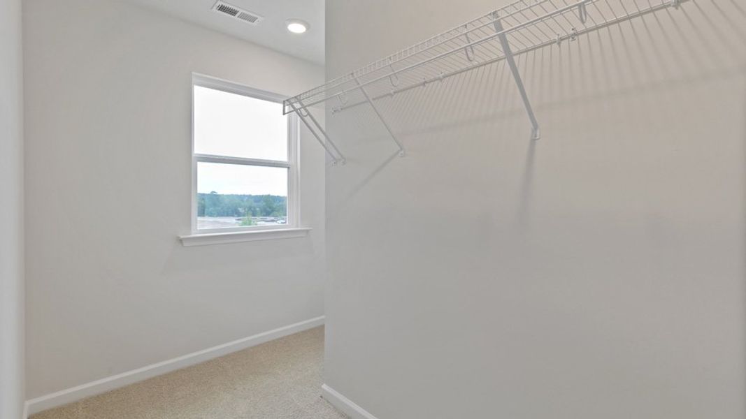 Spacious, unfurnished interior of a new home in The Grove at Matthews Landing, Fuquay Varina (Image 25).