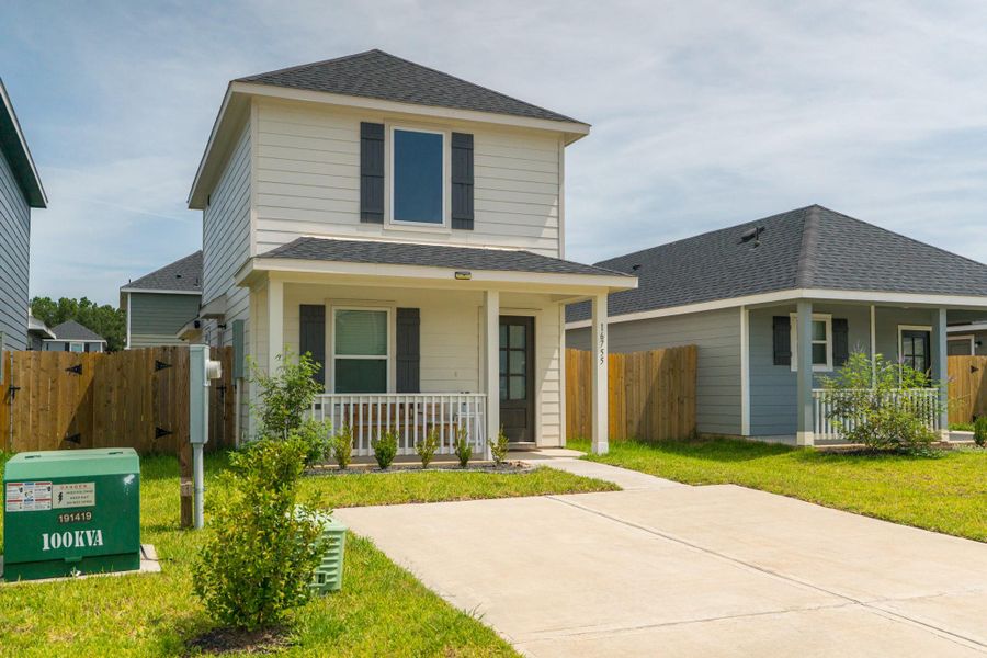 Front exterior of a new home in Marie Village, Conroe, TX, highlighting curb appeal (Image 27). Front exterior of a new home in Marie Village, Conroe, TX, highlighting curb appeal (Image 27).
