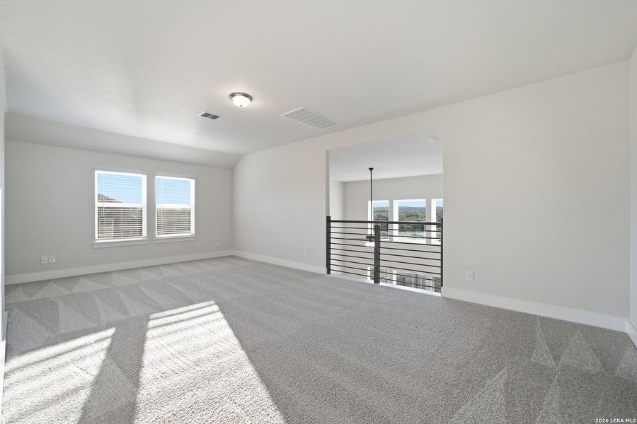 Spacious, unfurnished interior of a new home in The Woodlands at Medina Hills, Mico (Image 21).