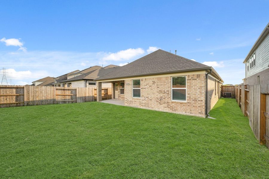 Front exterior of a new home in Sunterra North, Katy, TX, highlighting curb appeal (Image 7). Front exterior of a new home in Sunterra North, Katy, TX, highlighting curb appeal (Image 7).