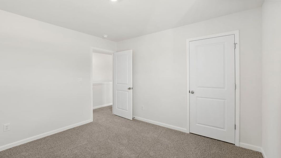 Spacious, unfurnished interior of a new home in Durbin Meadows Traditions, Fountain Inn (Image 32).