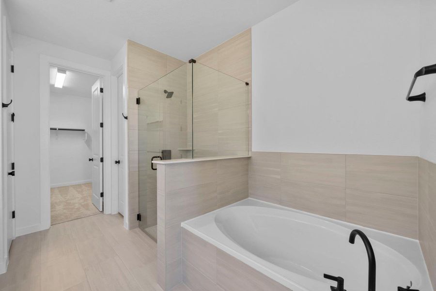 Primary Bath retreat with garden tub & walk-in shower Primary Bath retreat with garden tub & walk-in shower