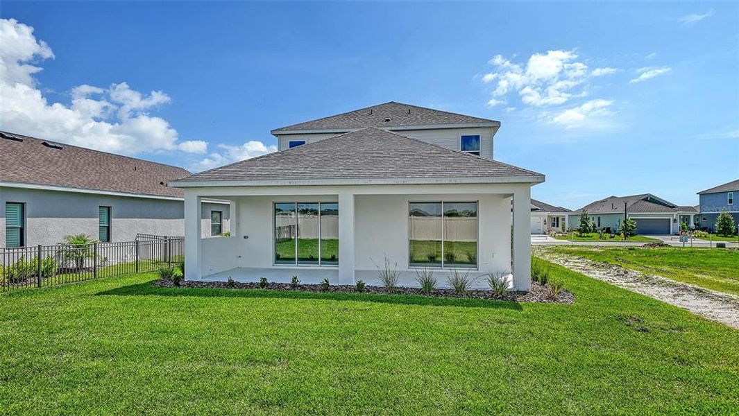 Exterior details and patio area of a home in Canoe Creek, Parrish (Image 21).