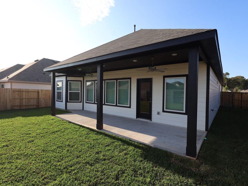 Exterior details and patio area of a home in Pinewood at Grand Texas, New Caney (Image 4).
