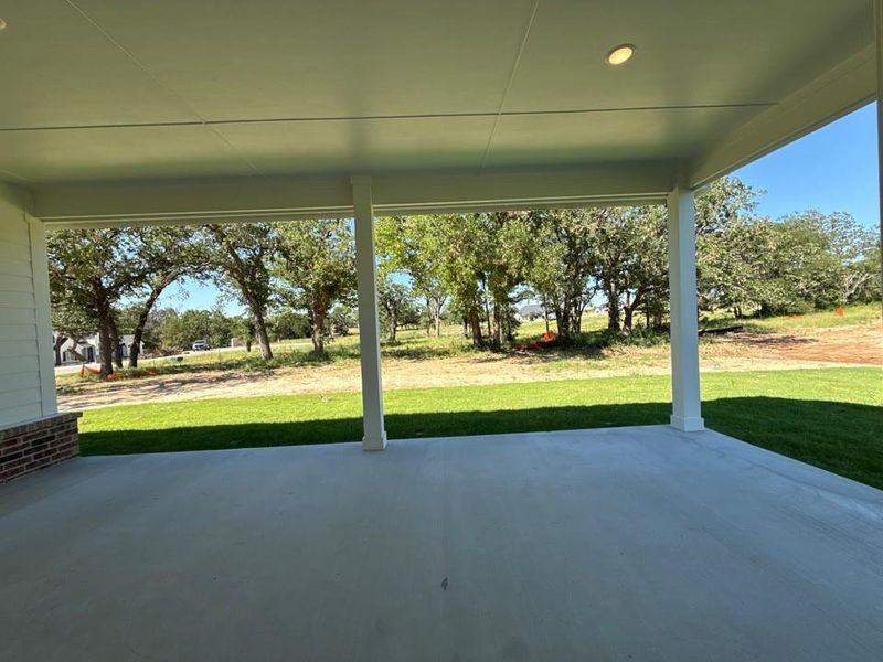 Exterior details and patio area of a home in Oak Grove Addition, Springtown (Image 4).