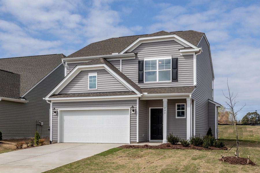 Front exterior of a new home in Daniel Farms, Benson, NC, highlighting curb appeal (Image 2). Front exterior of a new home in Daniel Farms, Benson, NC, highlighting curb appeal (Image 2).
