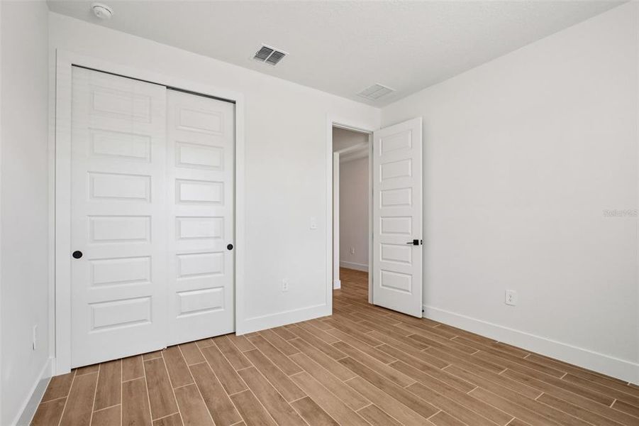 Spacious, unfurnished interior of a new home in Magnolia Bay - Reserve Series, Nokomis (Image 25).
