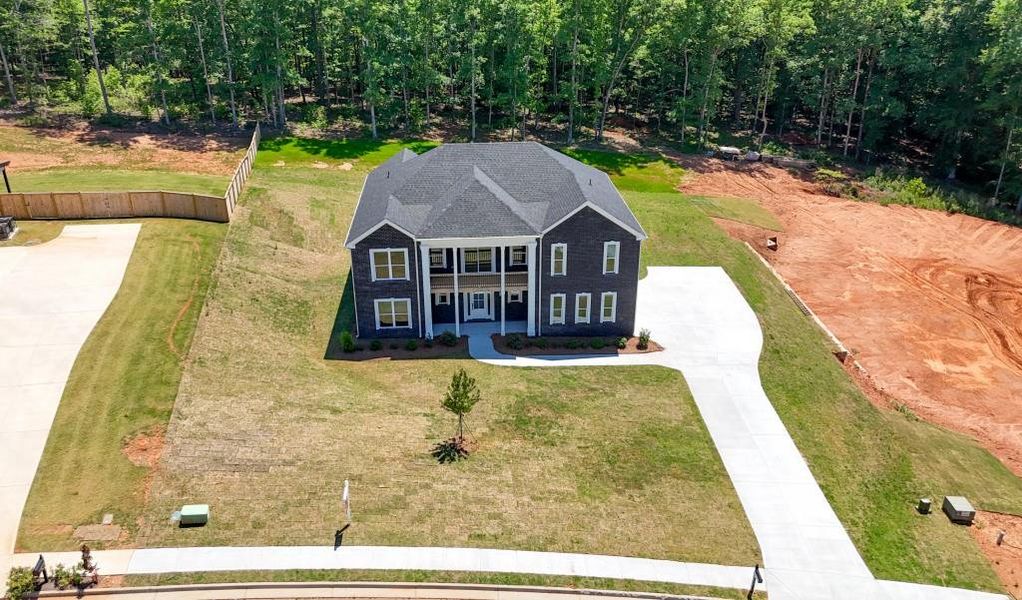 Front exterior of a new home in , Griffin, GA, highlighting curb appeal (Image 27).