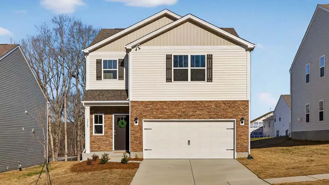 Front exterior of a new home in Zion Springs, Hickory, NC, highlighting curb appeal (Image 1). Front exterior of a new home in Zion Springs, Hickory, NC, highlighting curb appeal (Image 1).