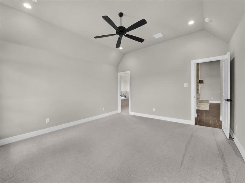 Unfurnished bedroom with vaulted ceiling, recessed lighting, carpet, and ceiling fan Unfurnished bedroom with vaulted ceiling, recessed lighting, carpet, and ceiling fan