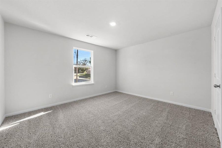 Spare room featuring carpet floors