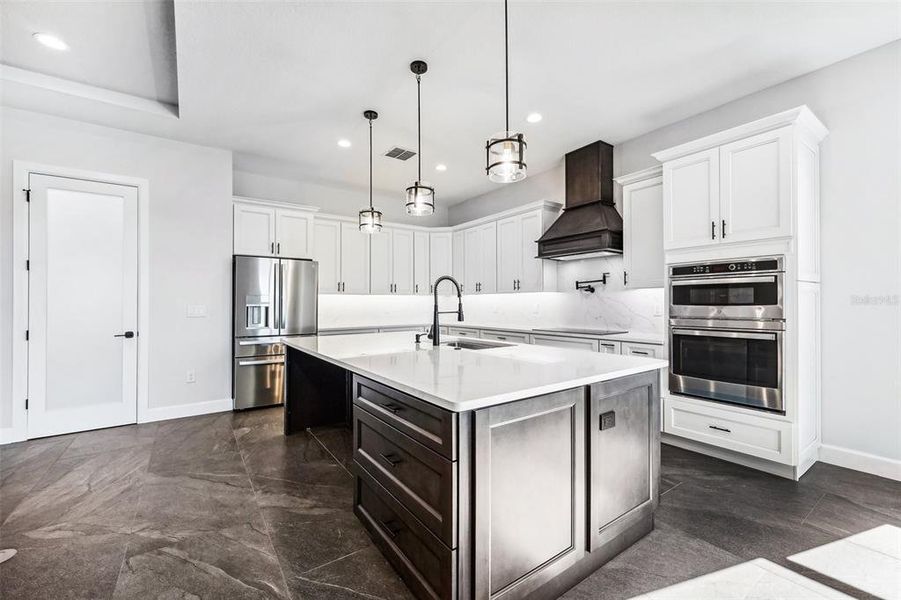 Kitchen Island & wWalk-in Pantry with a glass door