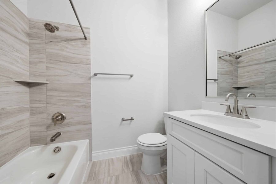 Furnished interior view inside a new home in The Woodlands Hills 65′, Willis (Image 31).