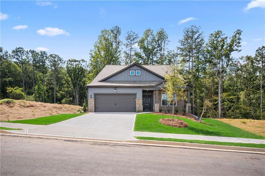 Front exterior of a new home in Cambridge at Steels Bridge: Steels Bridge, Canton, GA, highlighting curb appeal (Image 20). Front exterior of a new home in Cambridge at Steels Bridge: Steels Bridge, Canton, GA, highlighting curb appeal (Image 20).